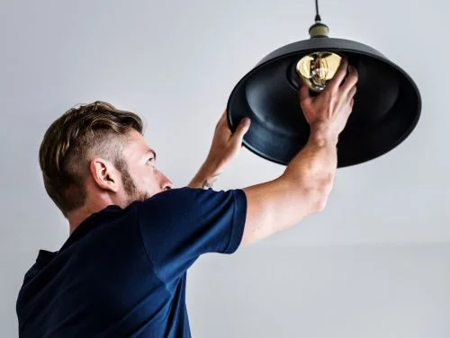 Man Changing Bulbs